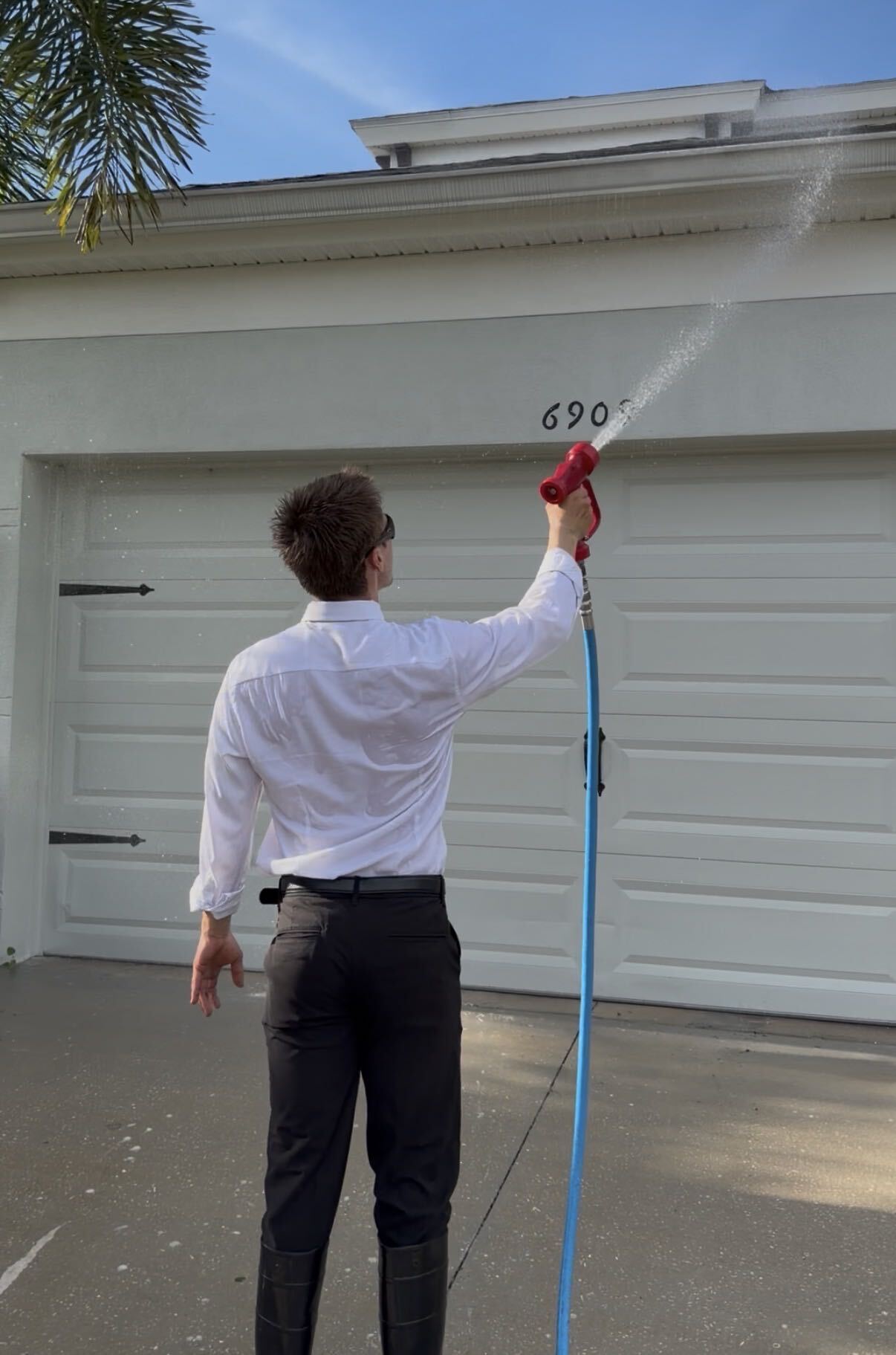 Black Tie team working on a home exterior
